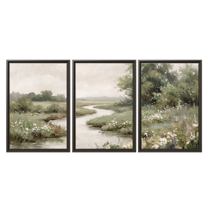 A narrow winding stream through quiet green meadows and trees 3 piece framed canvas wall art viewed straight on
