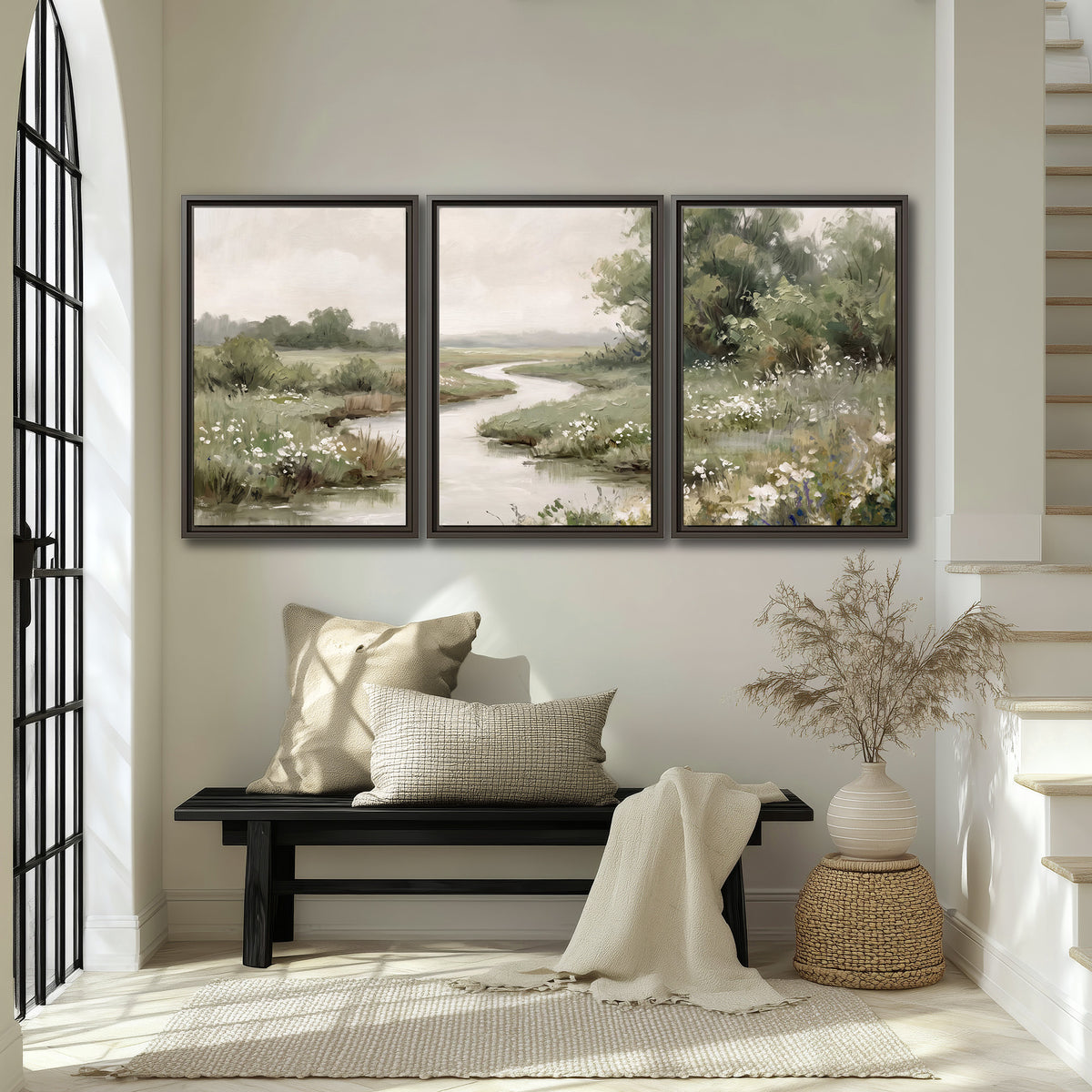 A narrow winding stream through quiet green meadows and trees 3 piece framed canvas wall art displayed in a entryway