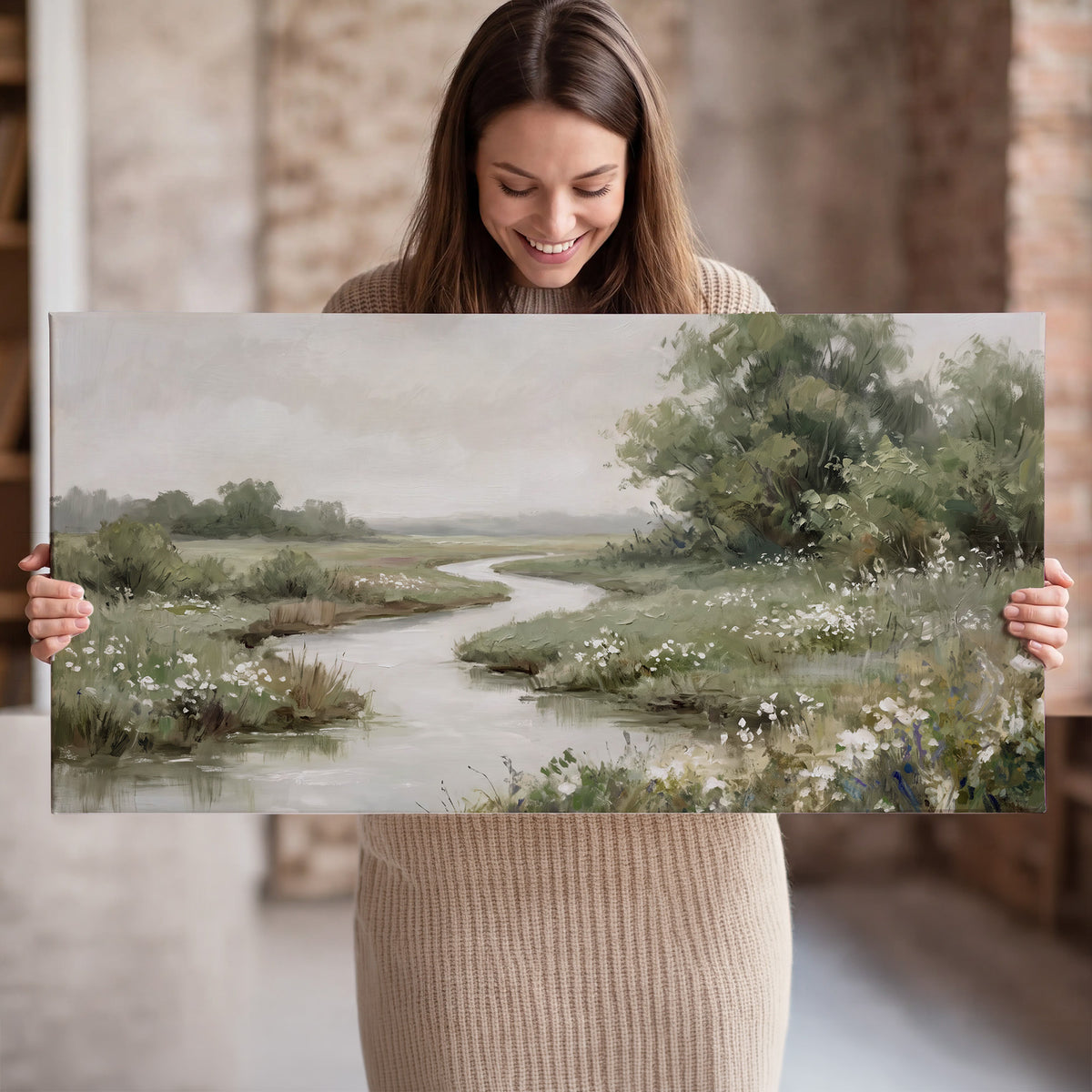 A narrow winding stream through quiet green meadows and trees single canvas wall art held in hands