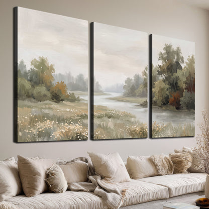 A broad pale river bordered by green trees and small meadow flowers 3 piece canvas wall art room and product view