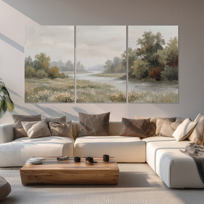 A broad pale river bordered by green trees and small meadow flowers set of 3 poster prints displayed in a living room