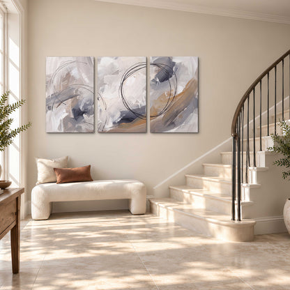 Expressive gray and cream abstract forms with fine gold-colored circular lines 3 piece canvas wall art styled in an interior