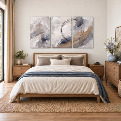 Expressive gray and cream abstract forms with fine gold-colored circular lines 3 piece canvas wall art styled in an interior