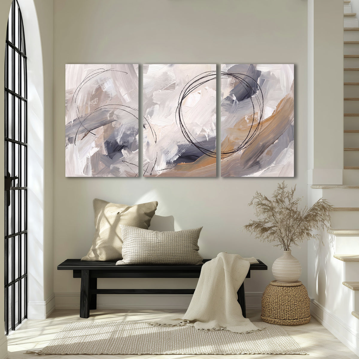 Expressive gray and cream abstract forms with fine gold-colored circular lines 3 piece canvas wall art displayed in a entryway
