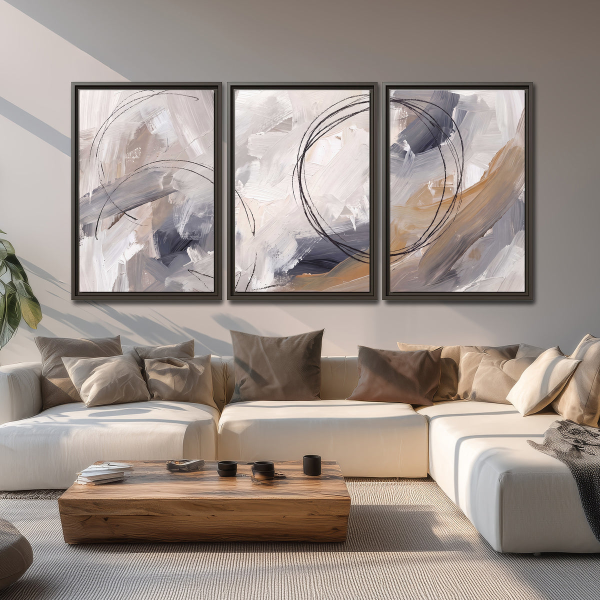 Expressive gray and cream abstract forms with fine gold-colored circular lines 3 piece framed canvas wall art displayed in a living room