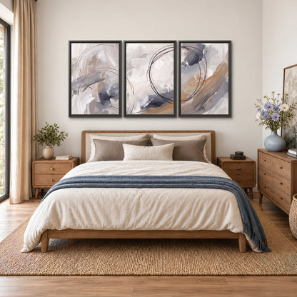 Expressive gray and cream abstract forms with fine gold-colored circular lines 3 piece framed canvas wall art styled in an interior