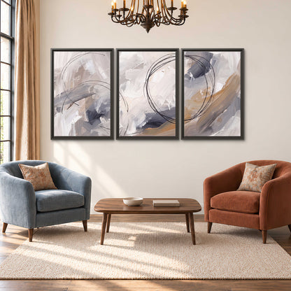 Expressive gray and cream abstract forms with fine gold-colored circular lines 3 piece framed canvas wall art styled in an interior