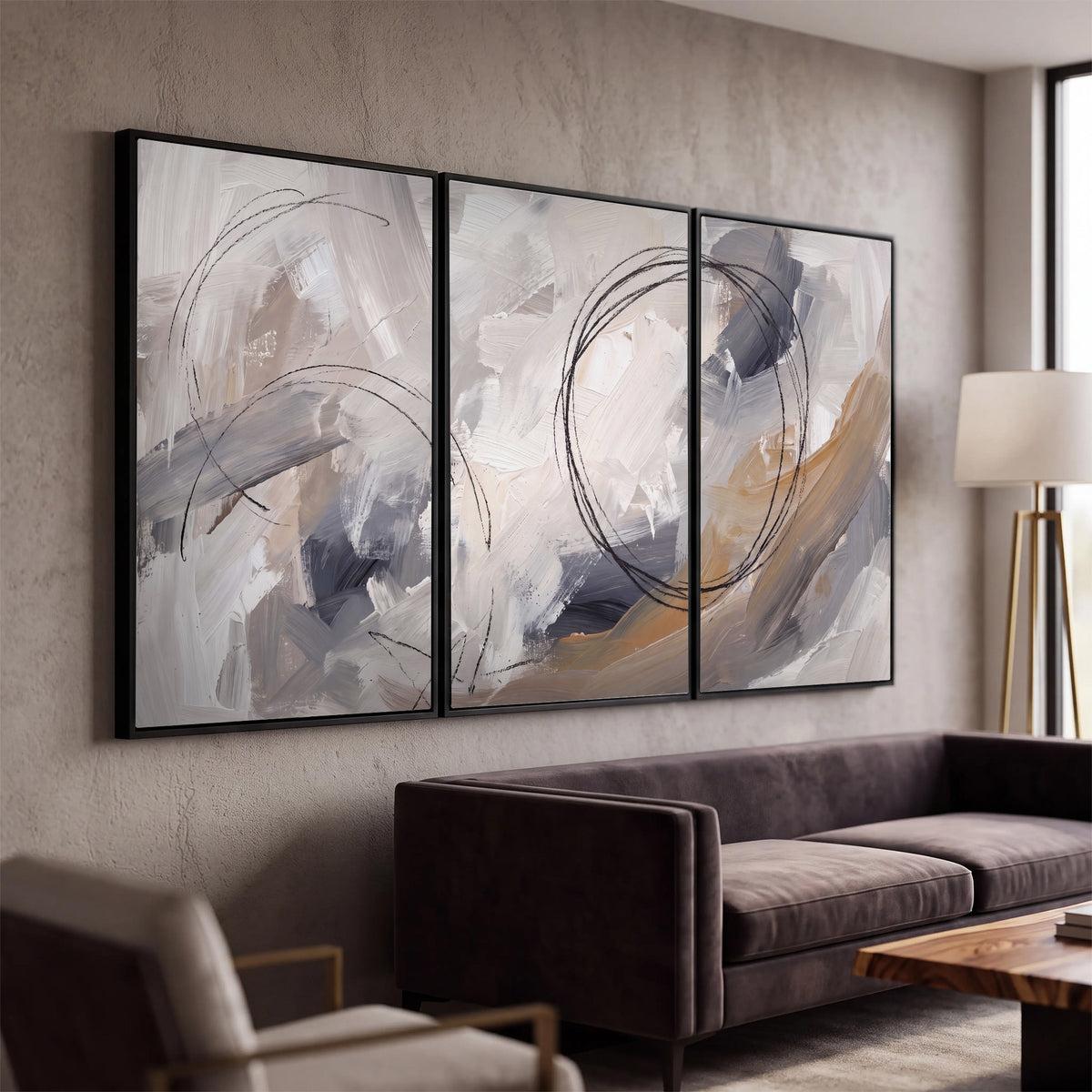 Expressive gray and cream abstract forms with fine gold-colored circular lines 3 piece framed canvas wall art displayed in a modern living room