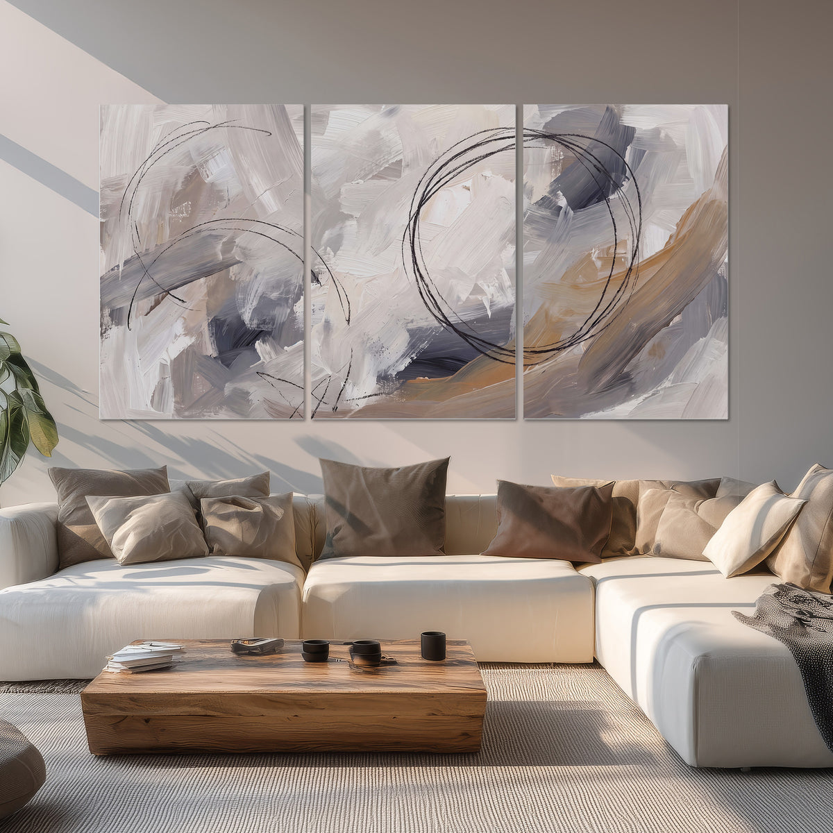 Expressive gray and cream abstract forms with fine gold-colored circular lines set of 3 poster prints displayed in a living room