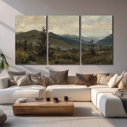 Layered mountain ridges and dark evergreen trees beneath a muted cloudy sky 3 piece canvas wall art displayed in a living room