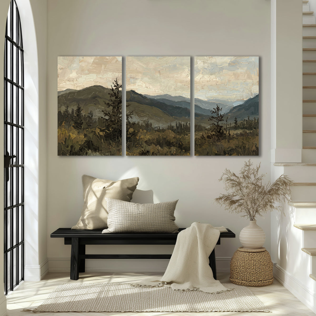Layered mountain ridges and dark evergreen trees beneath a muted cloudy sky 3 piece canvas wall art displayed in a entryway