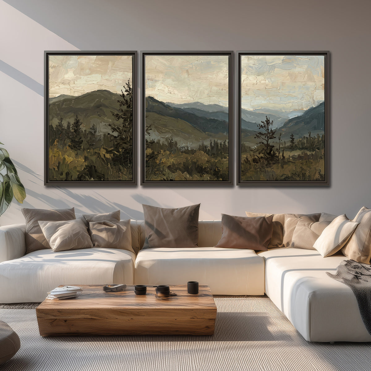 Layered mountain ridges and dark evergreen trees beneath a muted cloudy sky 3 piece framed canvas wall art displayed in a living room