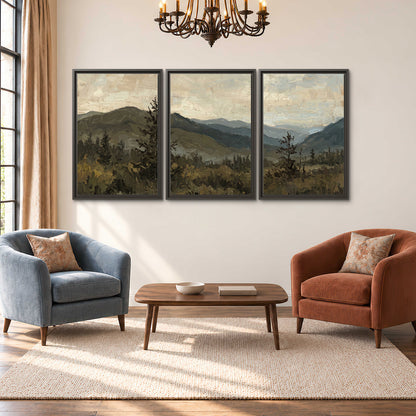 Layered mountain ridges and dark evergreen trees beneath a muted cloudy sky 3 piece framed canvas wall art styled in an interior