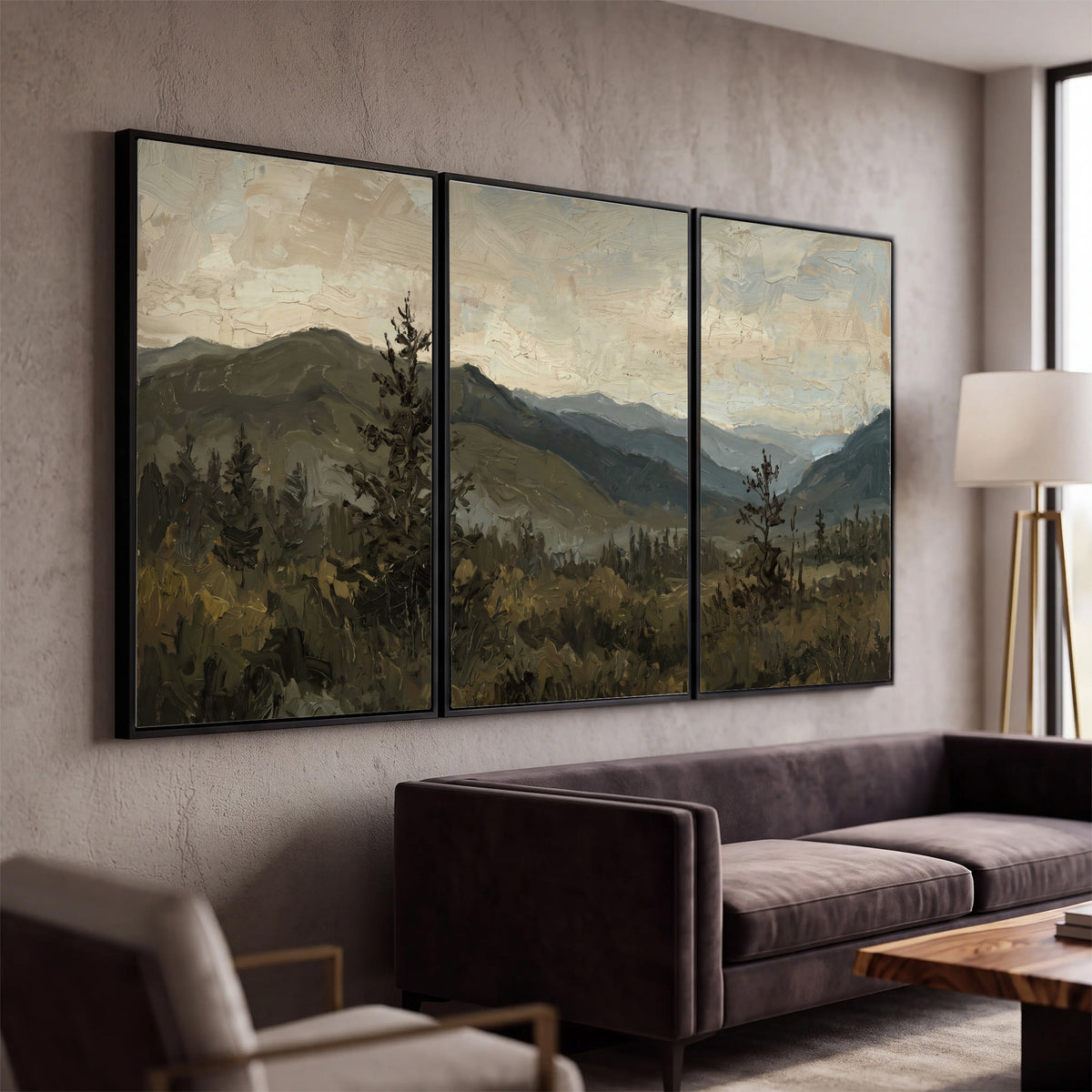Layered mountain ridges and dark evergreen trees beneath a muted cloudy sky 3 piece framed canvas wall art displayed in a modern living room