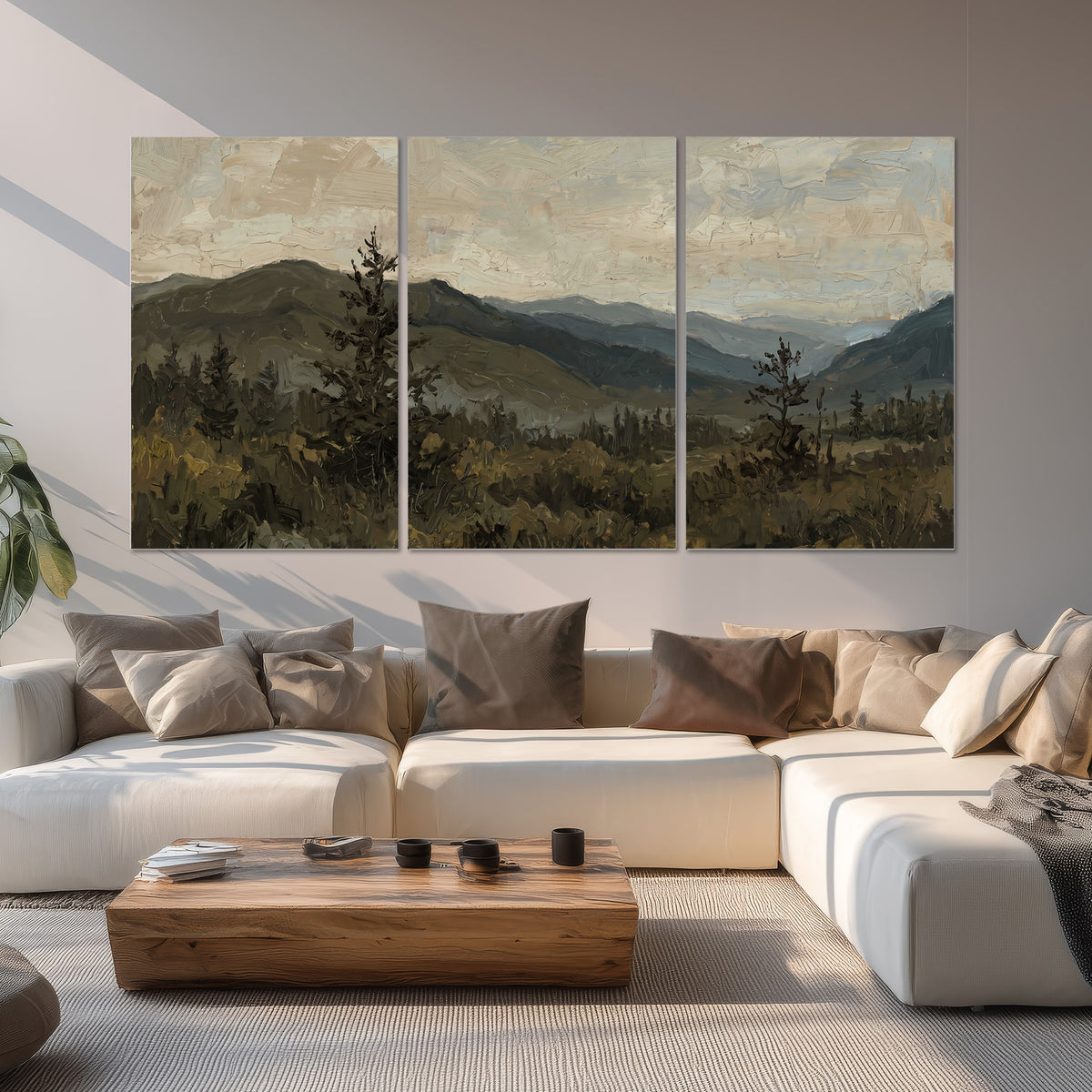 Layered mountain ridges and dark evergreen trees beneath a muted cloudy sky set of 3 poster prints displayed in a living room