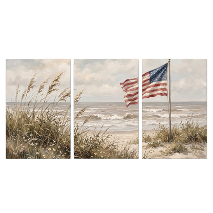 An American flag above coastal grasses beside a quiet sandy beach 3 piece canvas wall art viewed straight on