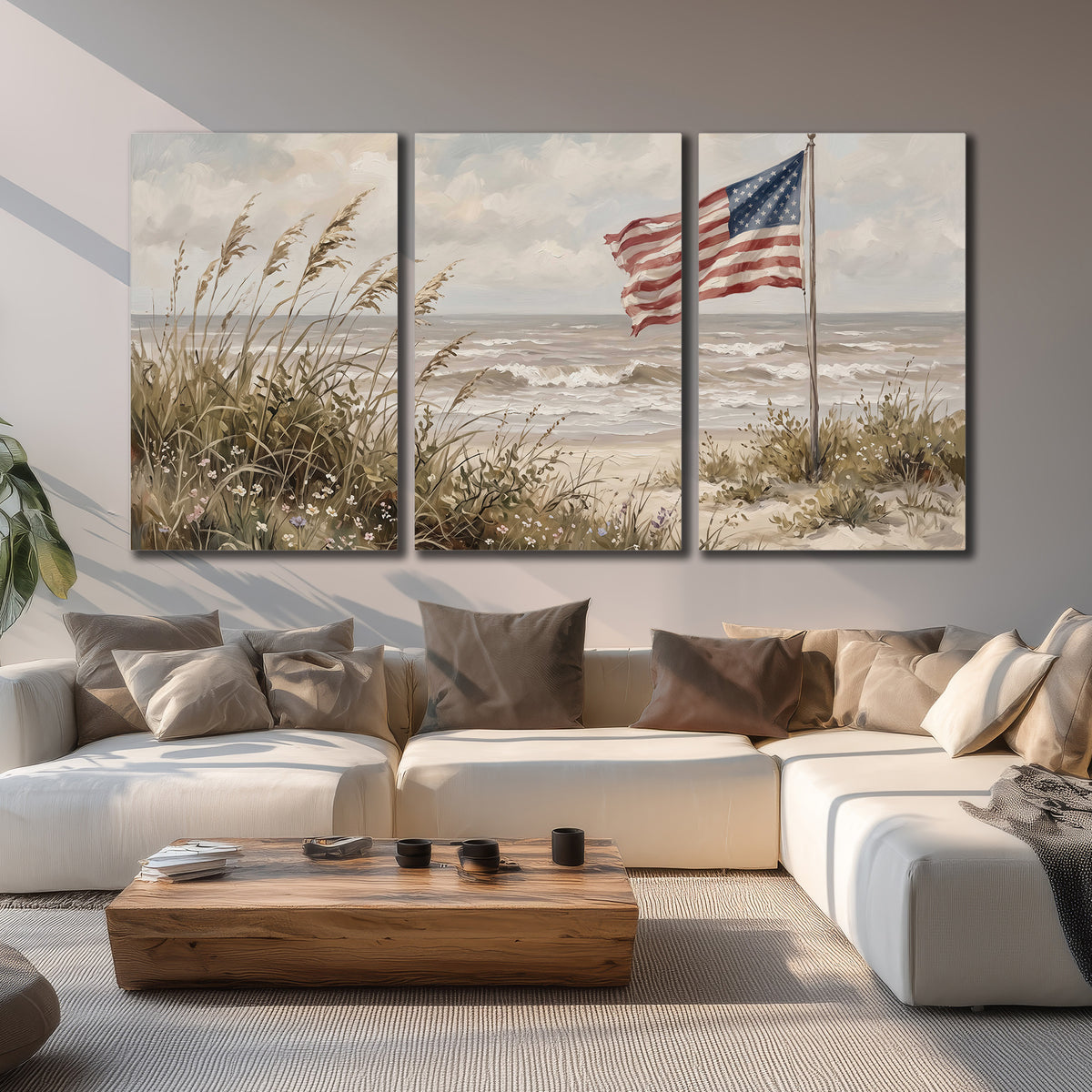 An American flag above coastal grasses beside a quiet sandy beach 3 piece canvas wall art displayed in a living room