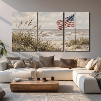 An American flag above coastal grasses beside a quiet sandy beach 3 piece canvas wall art displayed in a living room
