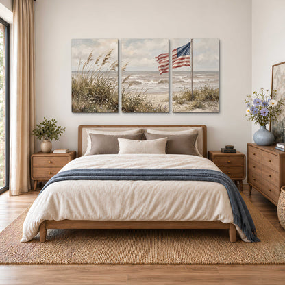 An American flag above coastal grasses beside a quiet sandy beach 3 piece canvas wall art styled in an interior