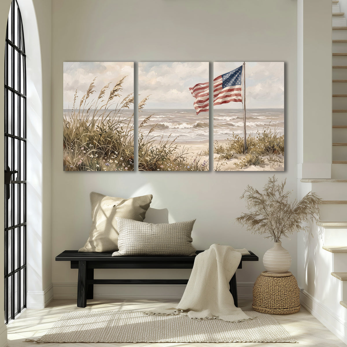 An American flag above coastal grasses beside a quiet sandy beach 3 piece canvas wall art displayed in a entryway