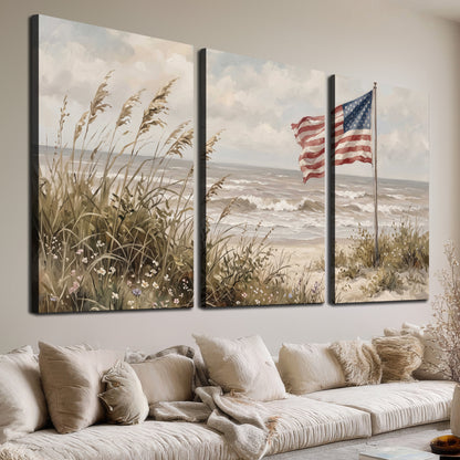 An American flag above coastal grasses beside a quiet sandy beach 3 piece canvas wall art room and product view