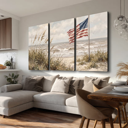 An American flag above coastal grasses beside a quiet sandy beach 3 piece canvas wall art room and product view