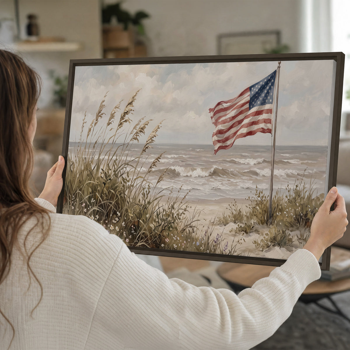 An American flag above coastal grasses beside a quiet sandy beach single framed canvas wall art held in hands