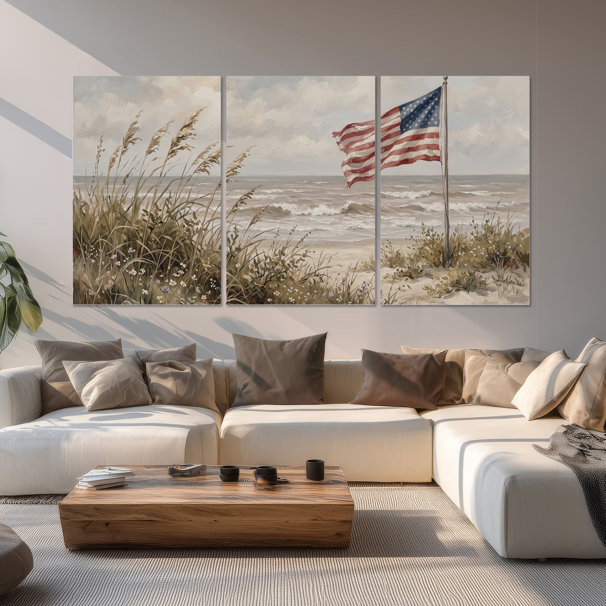 An American flag above coastal grasses beside a quiet sandy beach set of 3 poster prints displayed in a living room
