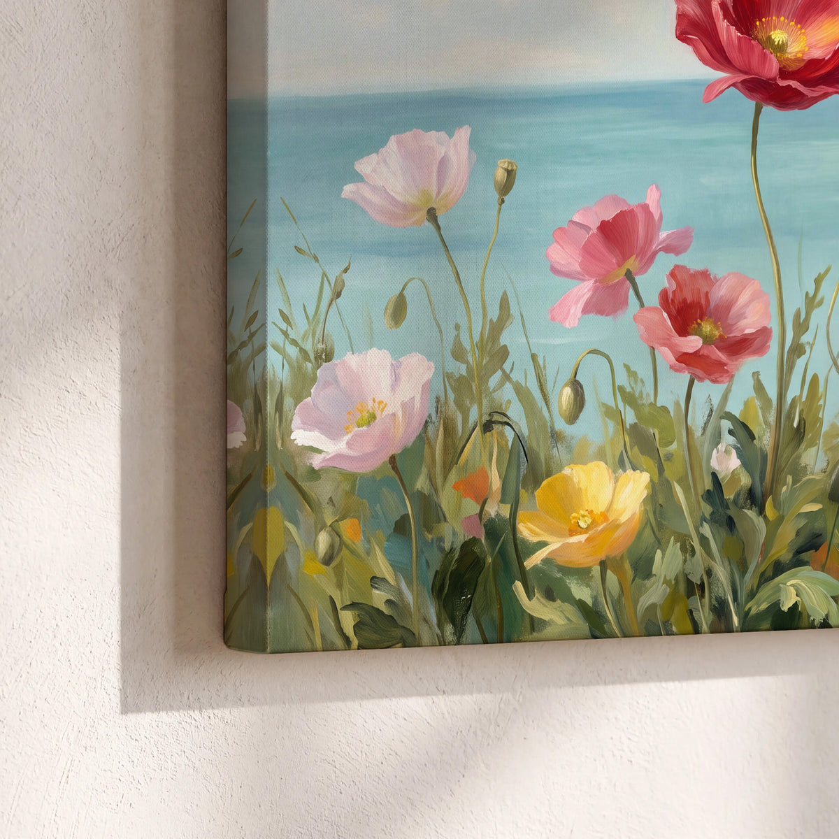Colorful red, peach and yellow flowers beside a turquoise sea 3 piece canvas wall art material and edge close up