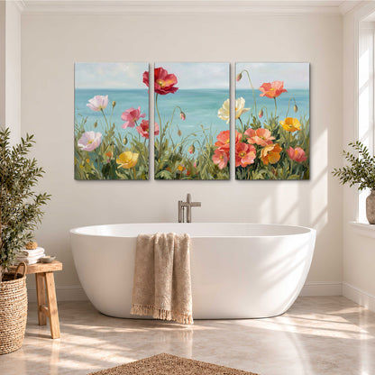 Colorful red, peach and yellow flowers beside a turquoise sea 3 piece canvas wall art styled in an interior