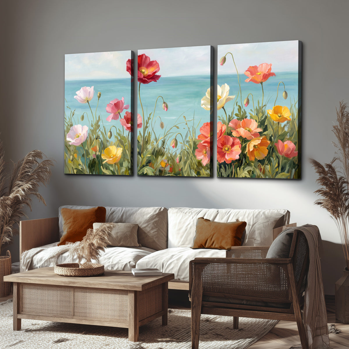 Colorful red, peach and yellow flowers beside a turquoise sea 3 piece canvas wall art displayed in a rustic living room