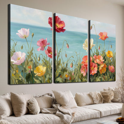 Colorful red, peach and yellow flowers beside a turquoise sea 3 piece canvas wall art room and product view