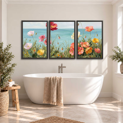 Colorful red, peach and yellow flowers beside a turquoise sea 3 piece framed canvas wall art styled in an interior