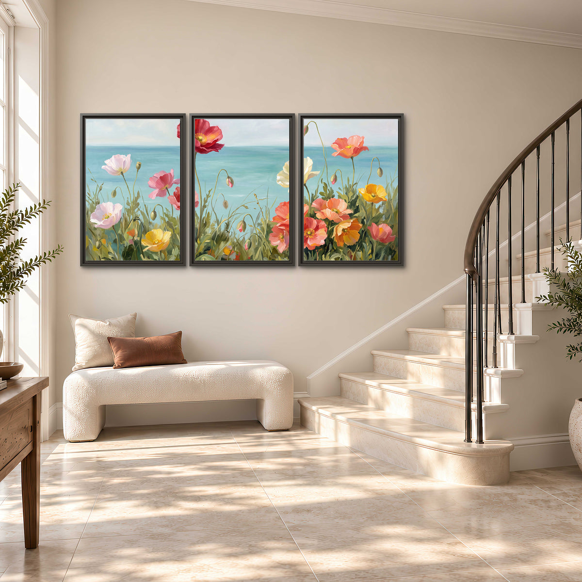 Colorful red, peach and yellow flowers beside a turquoise sea 3 piece framed canvas wall art styled in an interior