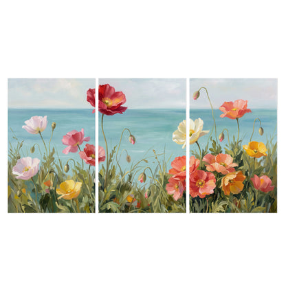 Colorful red, peach and yellow flowers beside a turquoise sea set of 3 poster prints viewed straight on