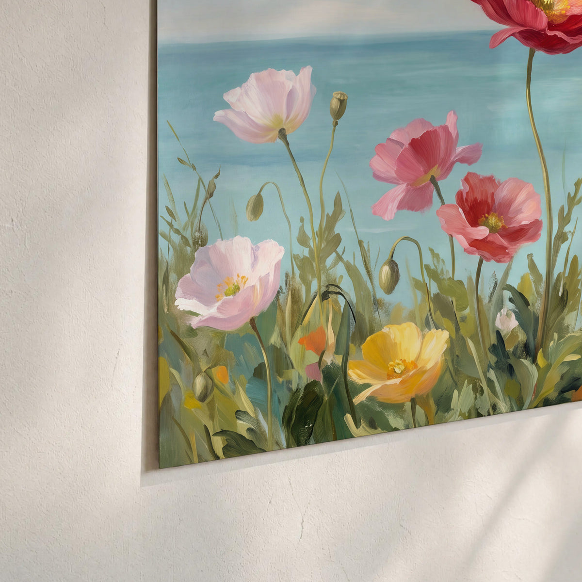 Colorful red, peach and yellow flowers beside a turquoise sea set of 3 poster prints material and edge close up