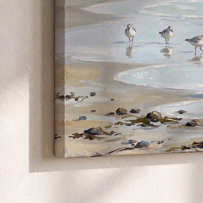 Small shorebirds standing along a pale blue shoreline 3 piece canvas wall art material and edge close up
