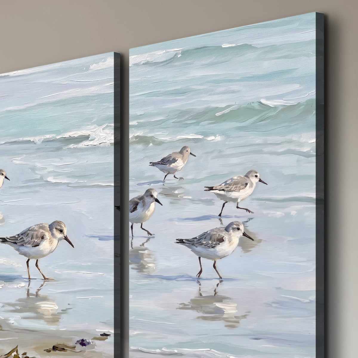 Small shorebirds standing along a pale blue shoreline 3 piece canvas wall art room and product view