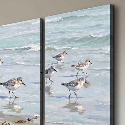 Small shorebirds standing along a pale blue shoreline 3 piece canvas wall art room and product view