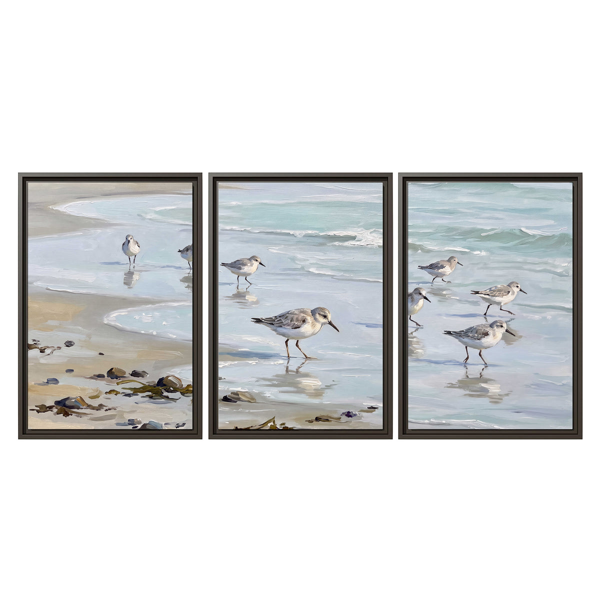 Small shorebirds standing along a pale blue shoreline 3 piece framed canvas wall art viewed straight on