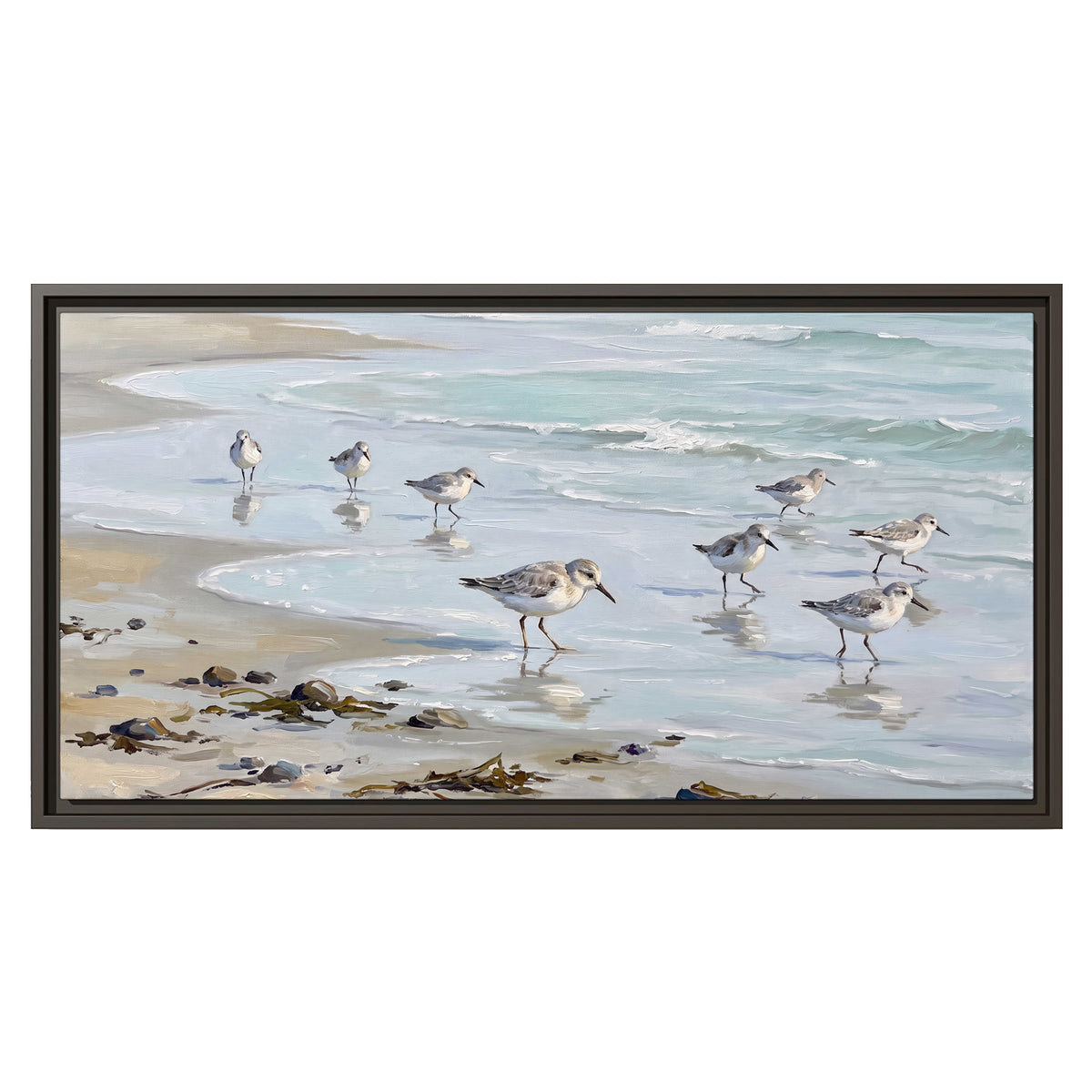 Small shorebirds standing along a pale blue shoreline single framed canvas wall art viewed straight on