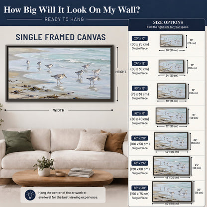 Small shorebirds standing along a pale blue shoreline single framed canvas wall art size guide above a sofa; room view is illustrative