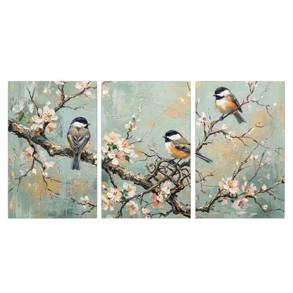 Small colorful songbirds perched among pale blossoms on soft aqua 3 piece canvas wall art viewed straight on