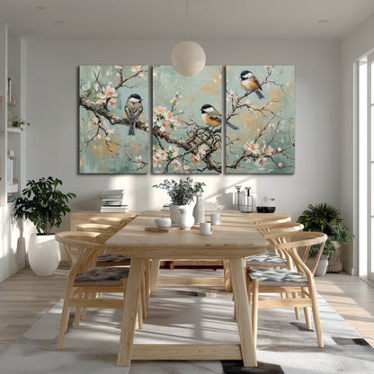 Small colorful songbirds perched among pale blossoms on soft aqua 3 piece canvas wall art room and product view