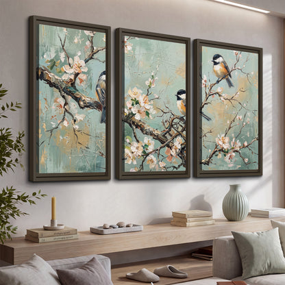Small colorful songbirds perched among pale blossoms on soft aqua 3 piece framed canvas wall art displayed in a console