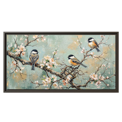 Small colorful songbirds perched among pale blossoms on soft aqua single framed canvas wall art viewed straight on