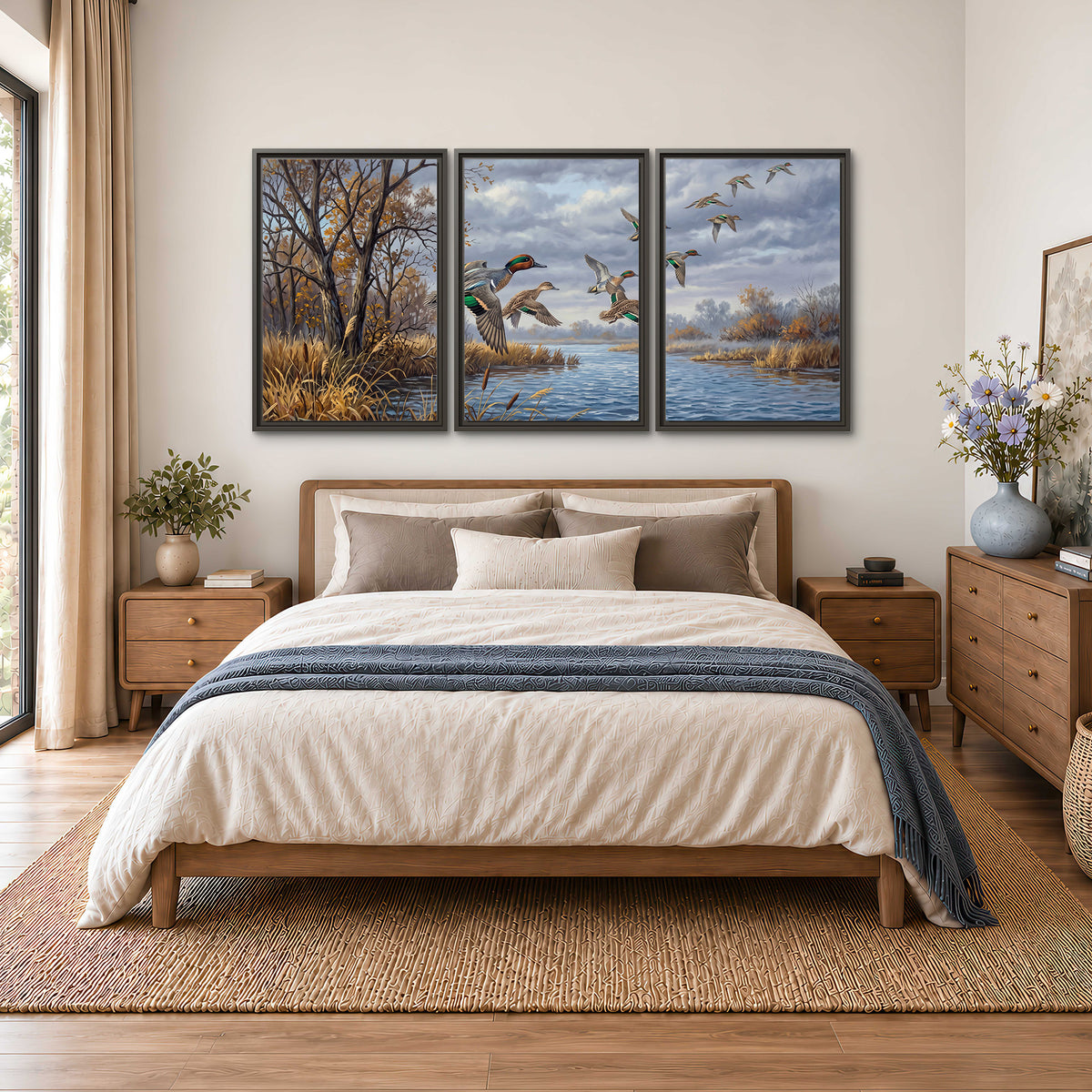 Ducks taking flight over a blue river framed by autumn branches 3 piece framed canvas wall art styled in an interior