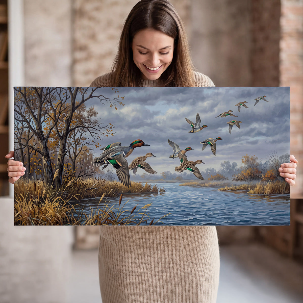 Ducks taking flight over a blue river framed by autumn branches single canvas wall art held in hands