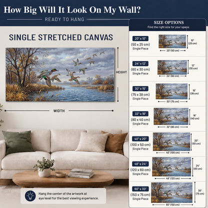Ducks taking flight over a blue river framed by autumn branches single canvas wall art size guide above a sofa; room view is illustrative