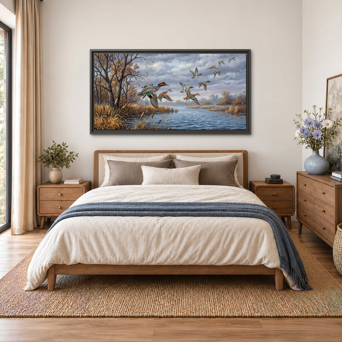 Ducks taking flight over a blue river framed by autumn branches single framed canvas wall art styled in an interior